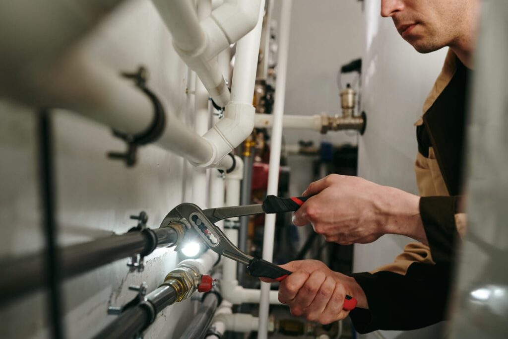 Plumbers maintaining commercial plumbing pipes in Leesburg
